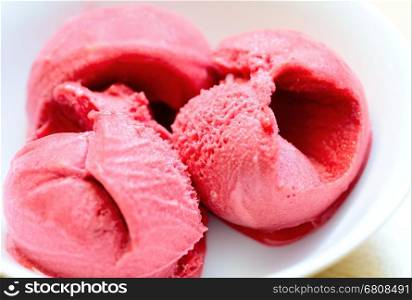 Raspberry ice cream sorbet scoops closeup. Raspberry sorbet. Ice cream sorbet. Fruit sorbet.