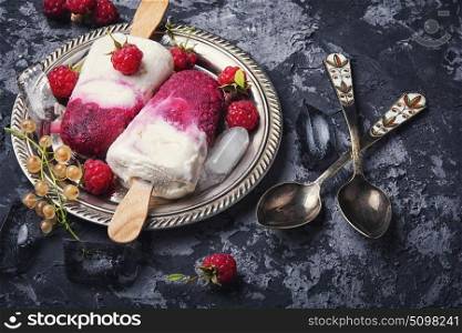 Raspberry ice cream. Summer ice cream on a stick with fresh raspberries