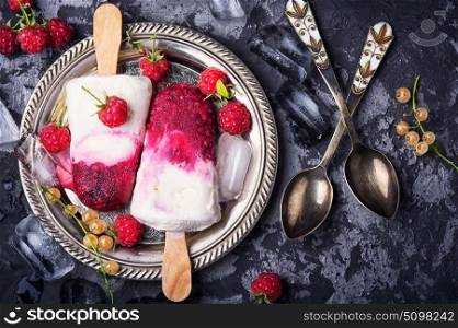 Raspberry ice cream. Summer ice cream on a stick with fresh raspberries.Top view, flat lay