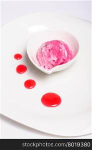 Raspberry layered cheese cake and pink ice cream ball, isolated on white