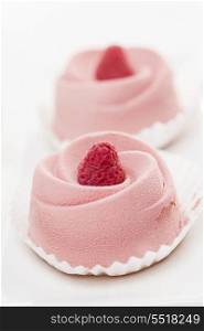 Raspberry mousse dessert. Closeup of two pink raspberry mousse desserts