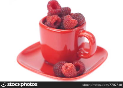 raspberry, saucer and cup is isolated on a white