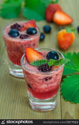 Raspberry smoothie with fresh berries. Raspberry smoothie with fresh berries on a wooden table