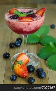 Raspberry smoothie with fresh berries. Raspberry smoothie with fresh berries on a wooden table