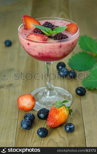 Raspberry smoothie with fresh berries. Raspberry smoothie with fresh berries on a wooden table