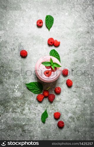 Raspberry smoothie with mint. On a stone background.. Raspberry smoothie with mint.