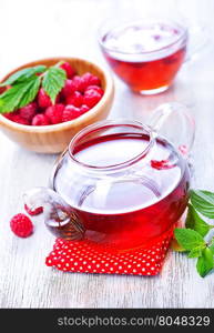 raspberry tea and fresh berries on a table