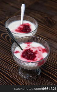 Raspberry yougurt on wooden background. Raspberry yougurt on wooden