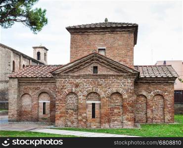 RAVENNA, ITALY - NOVEMBER 4, 2012: Ancient Galla Placidia mausoleum in Ravenna city. It was built between 425 and 433, this small mausoleum adopts a cruciform plan.