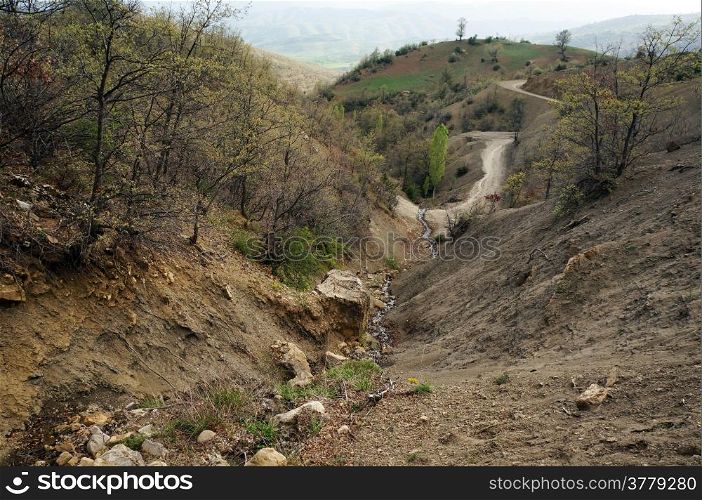 Ravine and dirt road in mountain area of Turkey