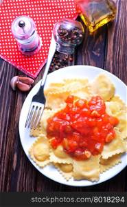 ravioli with tomato sauce on the plate