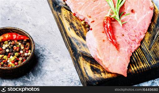 Raw beef meat. Raw beef fillet steaks with rosemary and spices.Raw meat