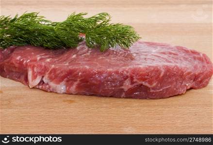 Raw beef. photo of a fresh raw beef and a fennel