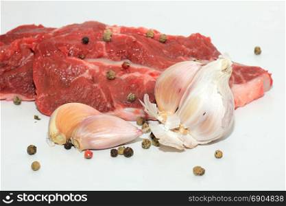 Raw beef, some garlic and mixed pepper