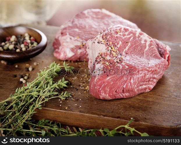Raw beef steak with spices. Raw beef steak