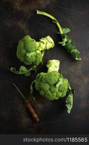 raw broccoli, fresh broccoli on wooden board