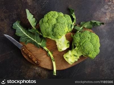 raw broccoli, fresh broccoli on wooden board