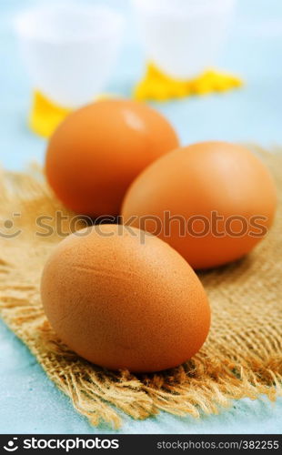 raw chicken egg on the kitchen table