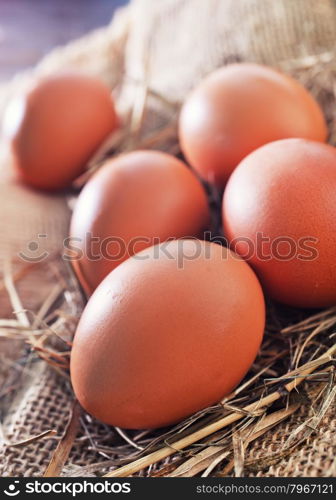 raw chicken eggs on the wooden table