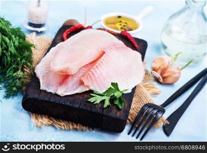 raw chicken fillet and aroma spice on a table