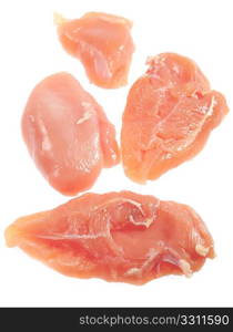 Raw chicken half-breasts over white, vertical, viewed from above