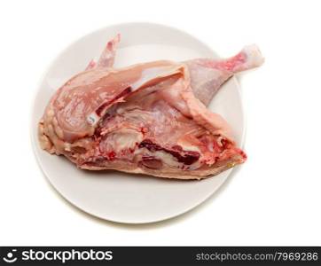Raw chicken on a plate in a cut. Isolate on white.