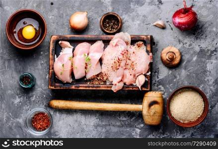 Raw chicken steaks on a kitchen board. Raw chicken on cutting board
