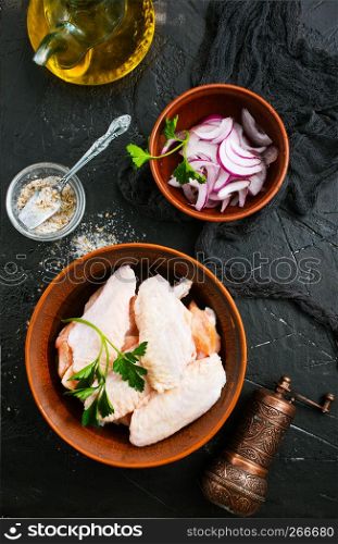 raw chicken wings with spice and salt