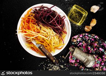 raw color carrots on white plate, salad