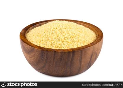 Raw couscous in a wooden bowl on white background