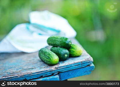 raw cucumbers on napkin and on a table