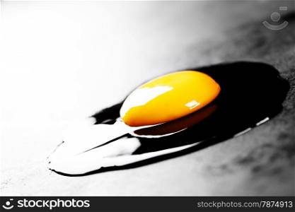 Raw egg on dark background