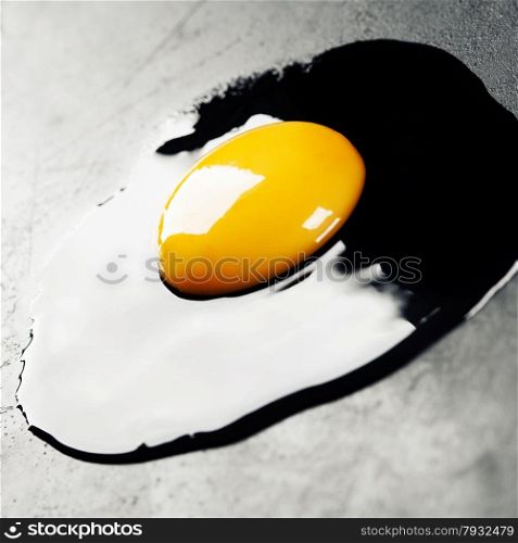 Raw egg on dark background