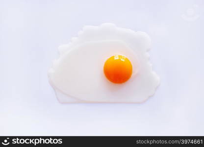 Raw egg yolk on white background