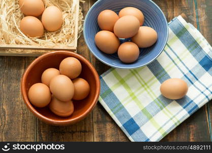 Raw eggs on a blue napkin. Healthy meal