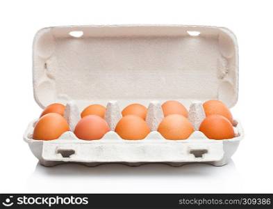 Raw farm fresh eggs in white paper tray isolated on white background