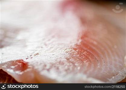 Raw fish fillet. Macro background. Texture of fish fillet. High quality photo. Raw fish fillet. Macro background. Texture of fish fillet.