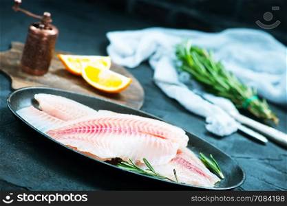 raw fish with spice and on a table