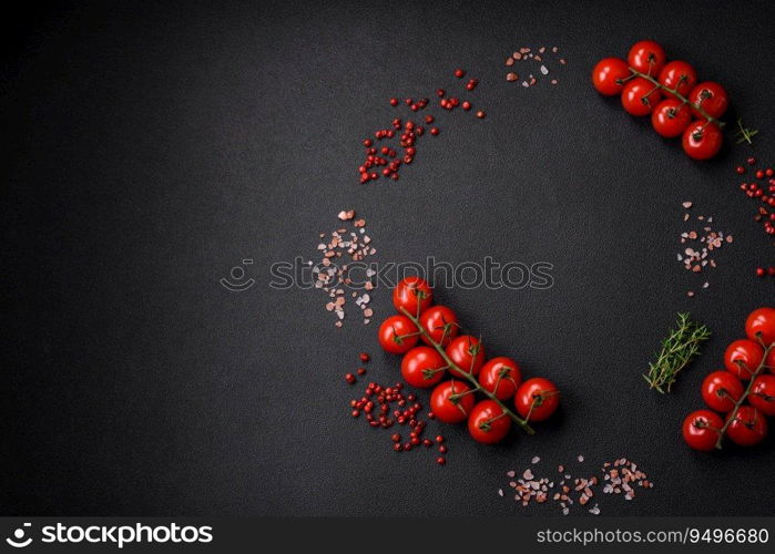 Raw fresh juicy beef t-bone steak with salt, spices and herbs on a dark concrete background