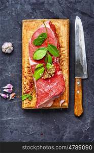 Raw fresh meat. Raw veal meat on kitchen board with spice