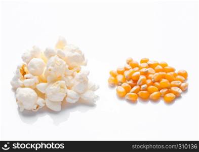 Raw golden sweet corn and popcorn seeds on white background