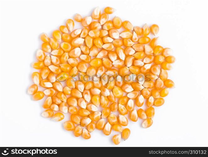 Raw golden sweet corn popcorn grain seeds on white