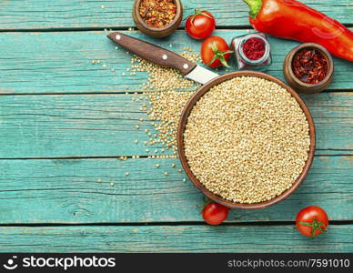 Raw green buckwheat on wooden background,vegan food. Green buckwheat on wooden table