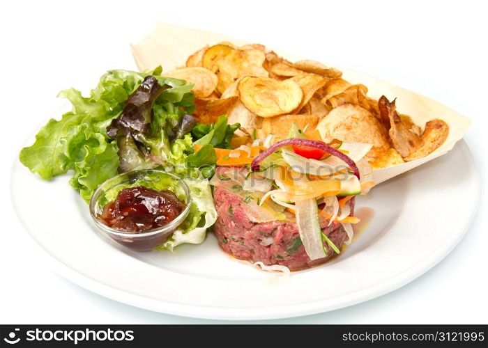 raw ground beef with chips and salad