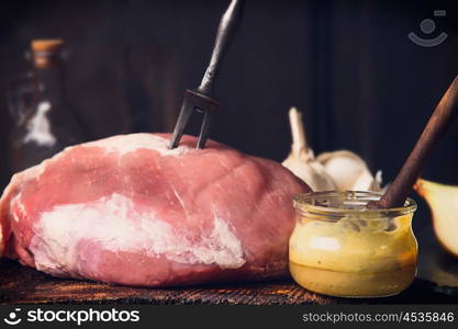 Raw ham meat with Honey Mustard Glaze in glass jar, close up