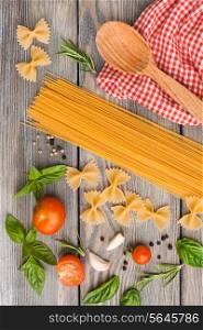 Raw Italian pasta with tomato sauce ingredients