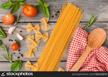 Raw Italian pasta with tomato sauce ingredients