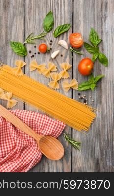 Raw Italian pasta with tomato sauce ingredients. Italian pasta
