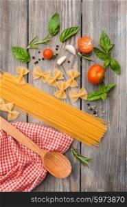 Raw Italian pasta with tomato sauce ingredients. Italian pasta