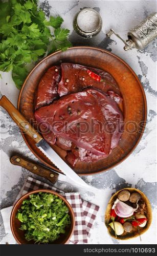 raw liver on plate on a table